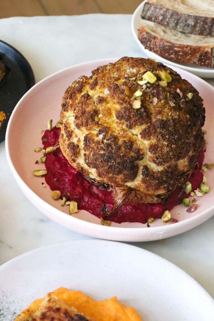 this plant based thanksgiving idea happens to be whole roasted cauliflower